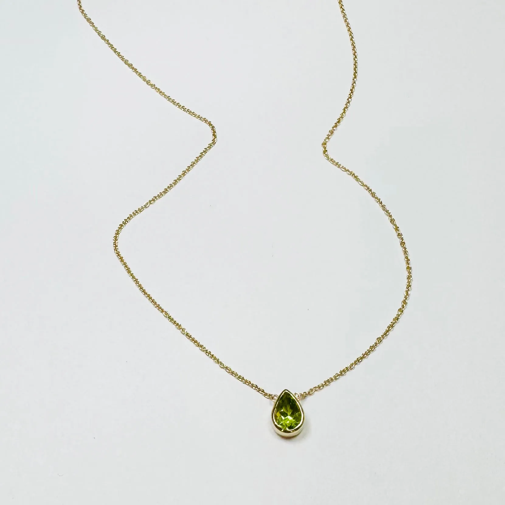 bezel set pear peridot necklace