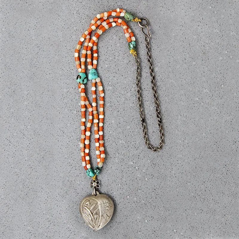 Chinese Repoussé Silver Heart Pendant on Beads