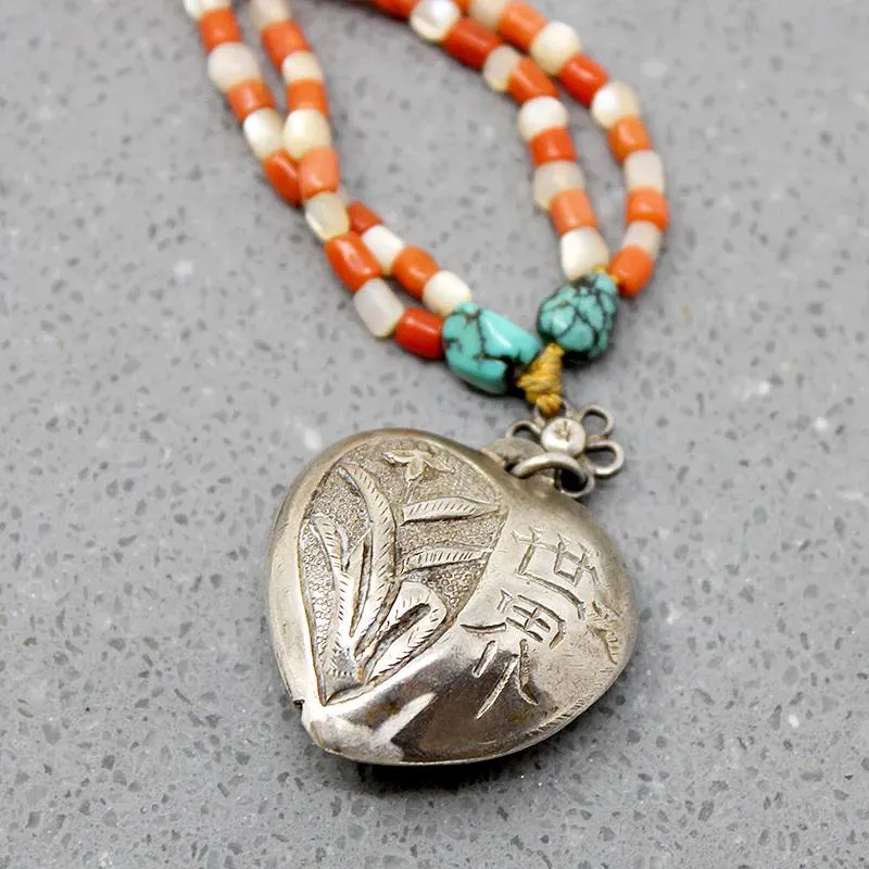 Chinese Repoussé Silver Heart Pendant on Beads