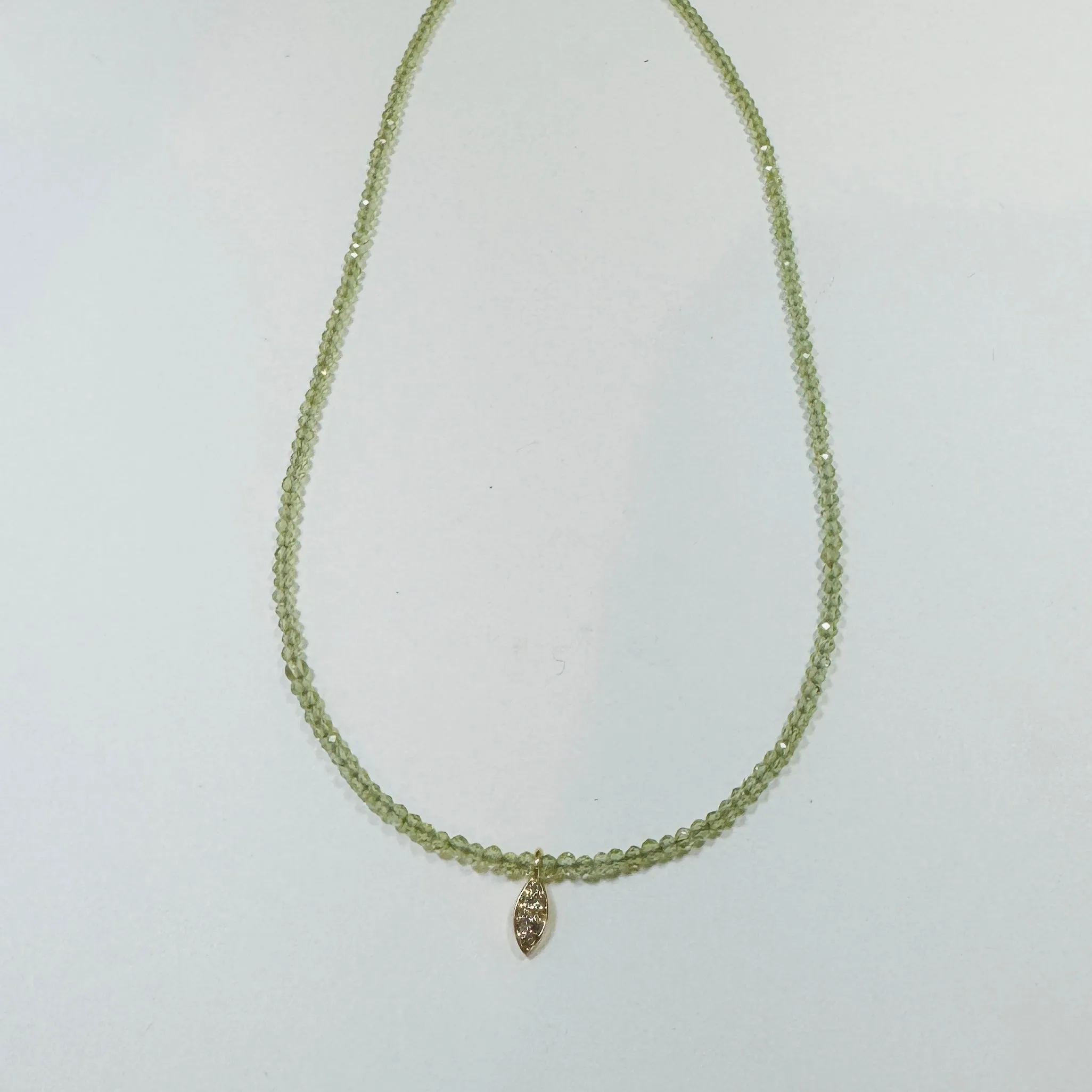 delicate peridot necklace with diamond charm