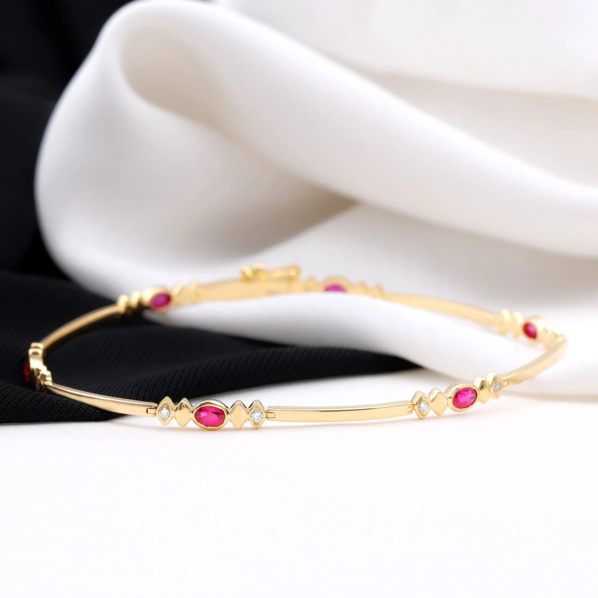 Oval Lab Grown Ruby Link Bracelet with Moissanite