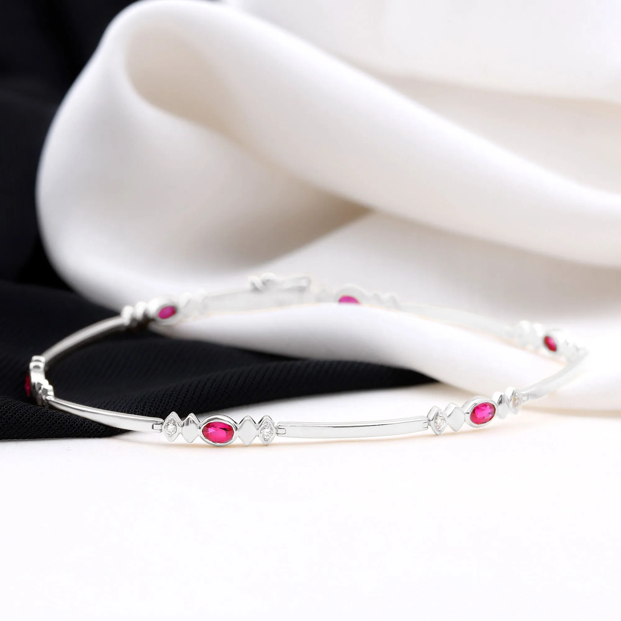 Oval Lab Grown Ruby Link Bracelet with Moissanite