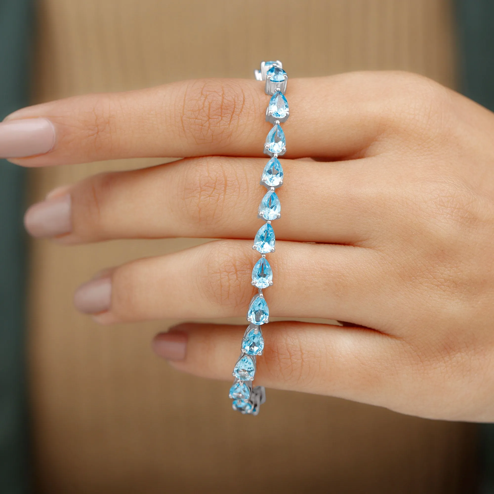 Pear Cut Swiss Blue Topaz East West Tennis Bracelet