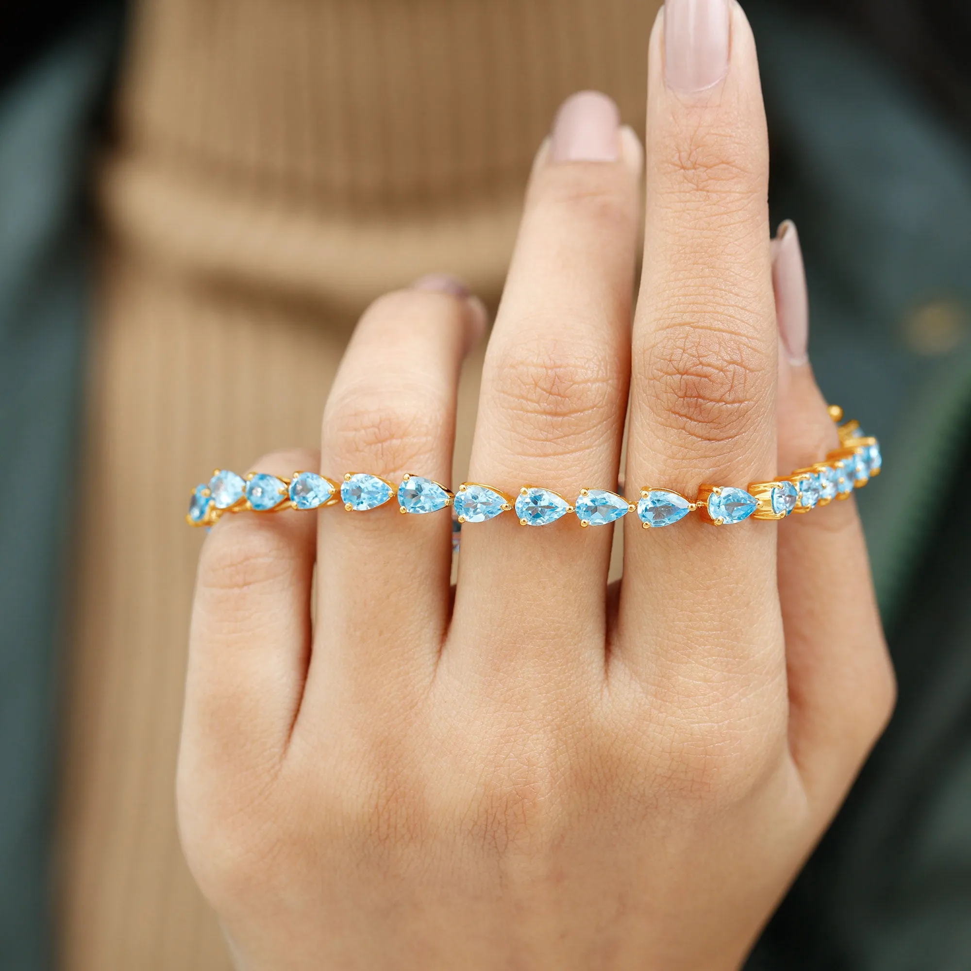 Pear Cut Swiss Blue Topaz East West Tennis Bracelet