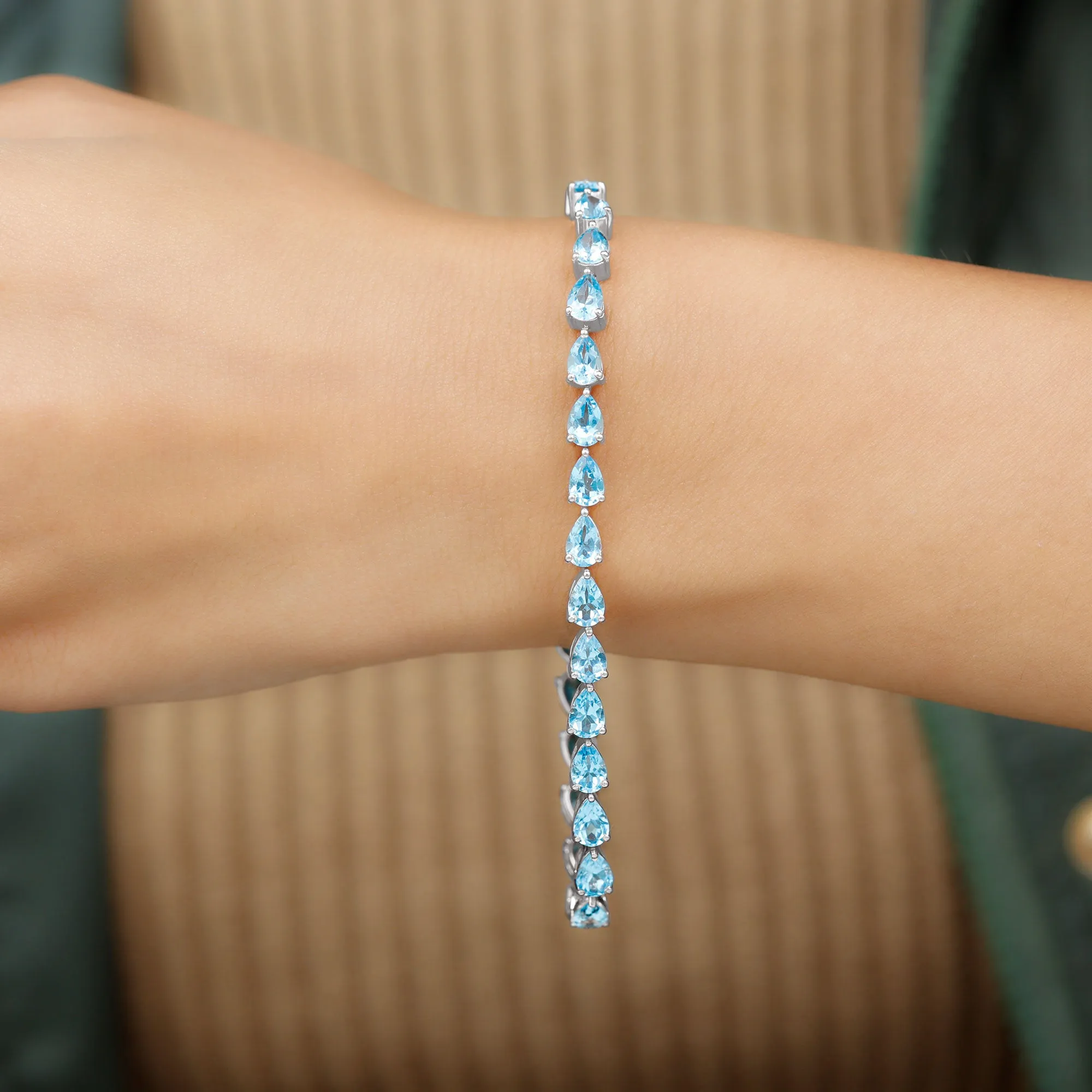 Pear Cut Swiss Blue Topaz East West Tennis Bracelet