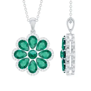 Pear Shape Created Emerald Flower Pendant with Moissanite