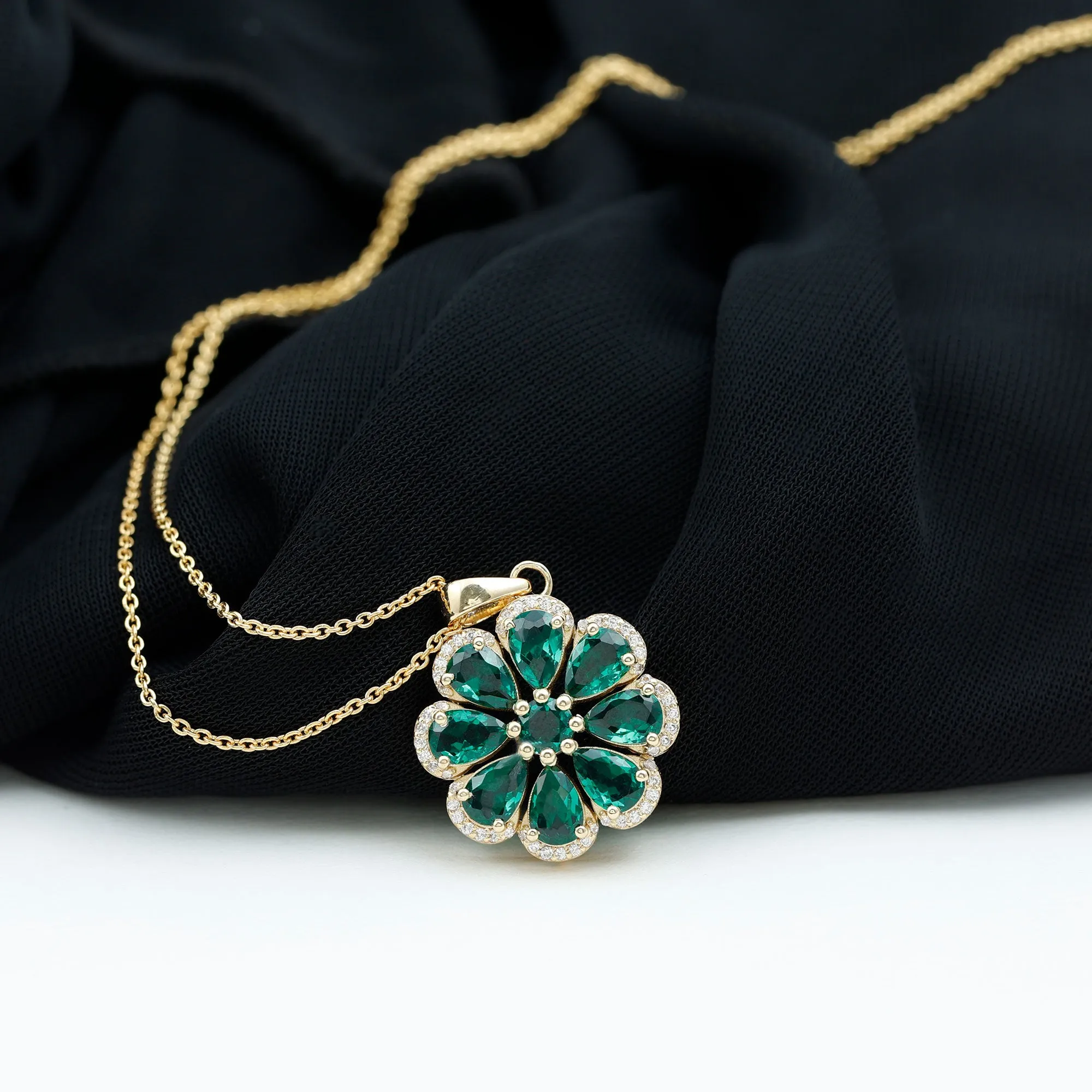 Pear Shape Created Emerald Flower Pendant with Moissanite