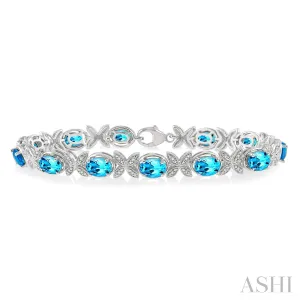 Sterling Silver Round Cut Diamond and Oval Cut Blue Topaz Bracelet